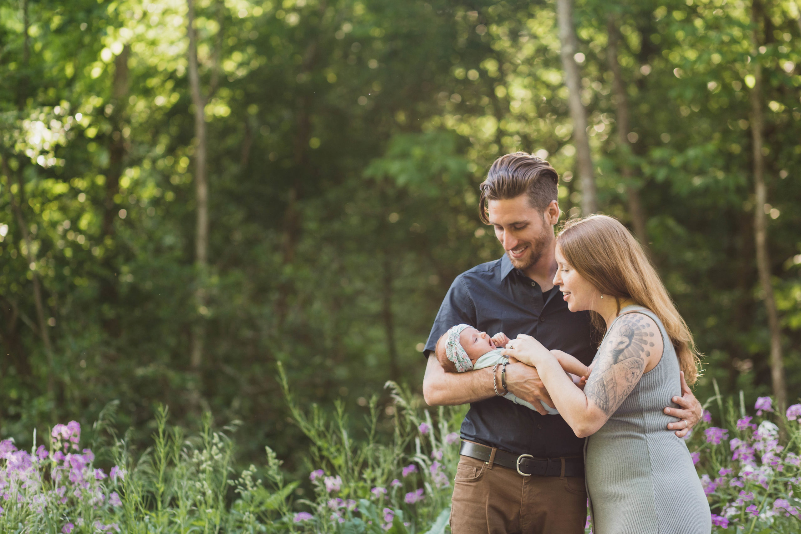 Delhi, NY Newborn Photographer, mom and dad outside holding baby girl