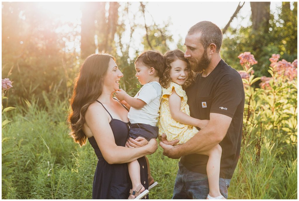 Upstate NY Family Photographer, family in summer cuddling 