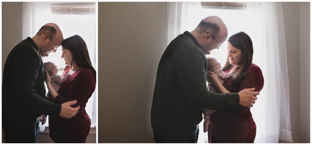 Oneonta NY newborn Photographer, Mom and dad snuggling baby girl. 